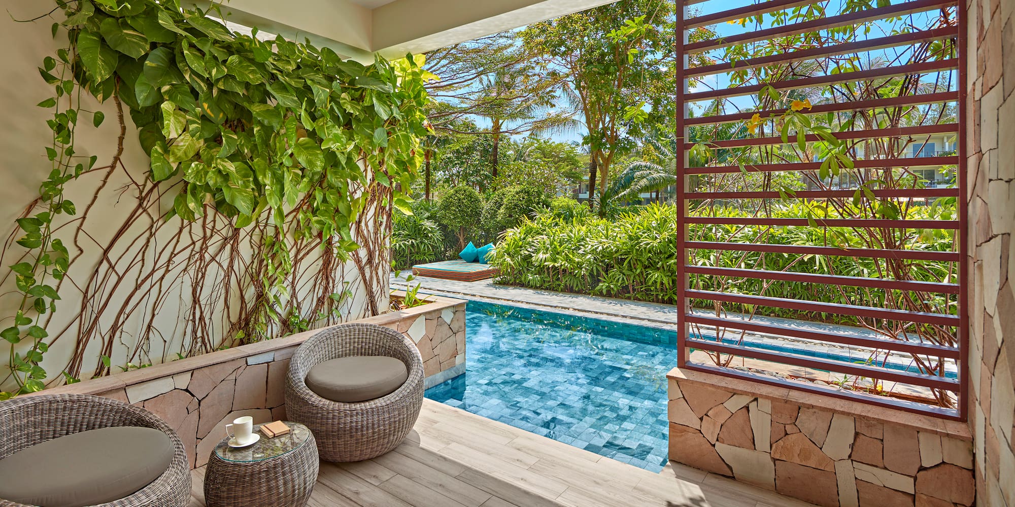 a pool with a chair and a table