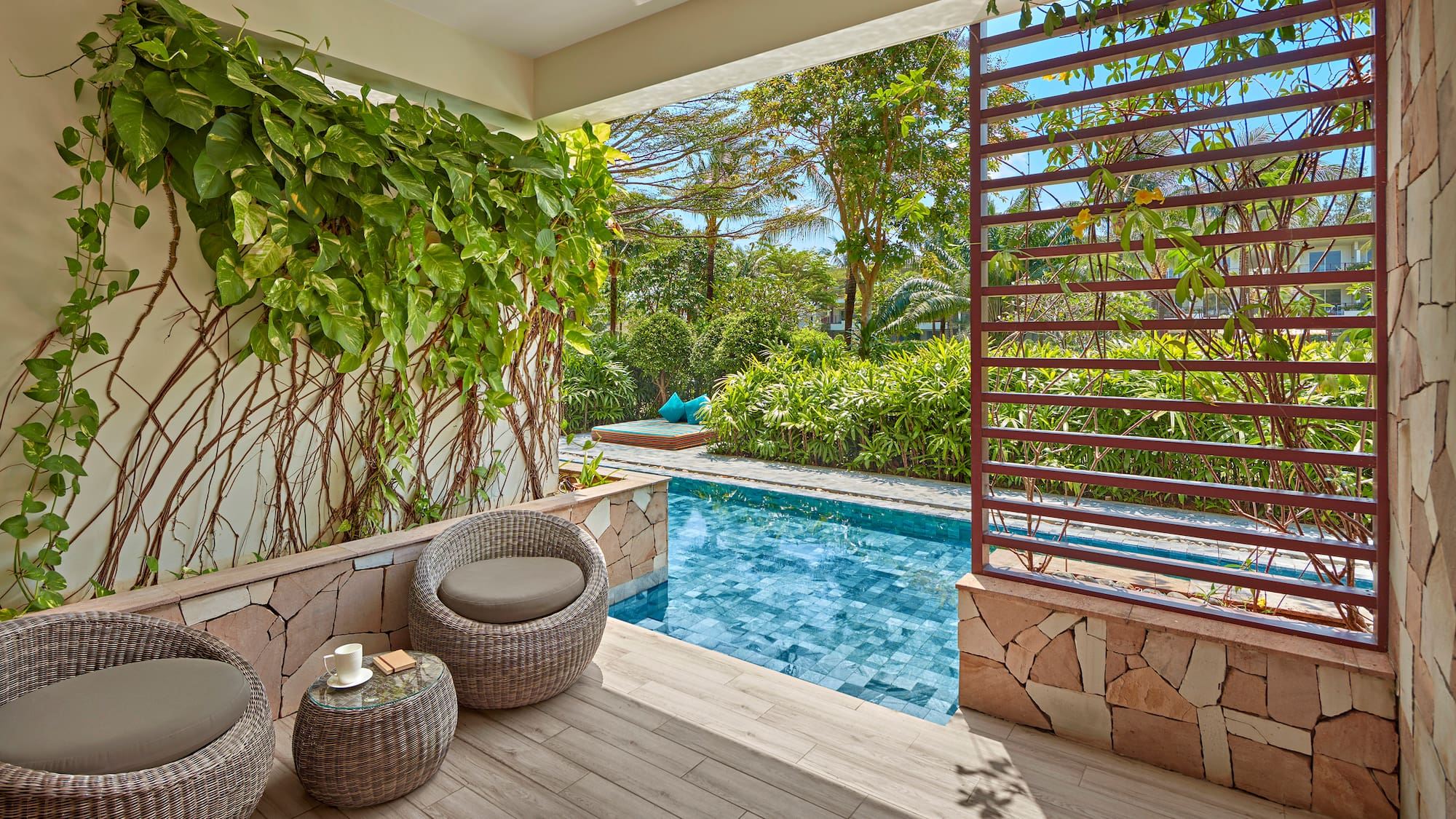 a pool with a chair and a table