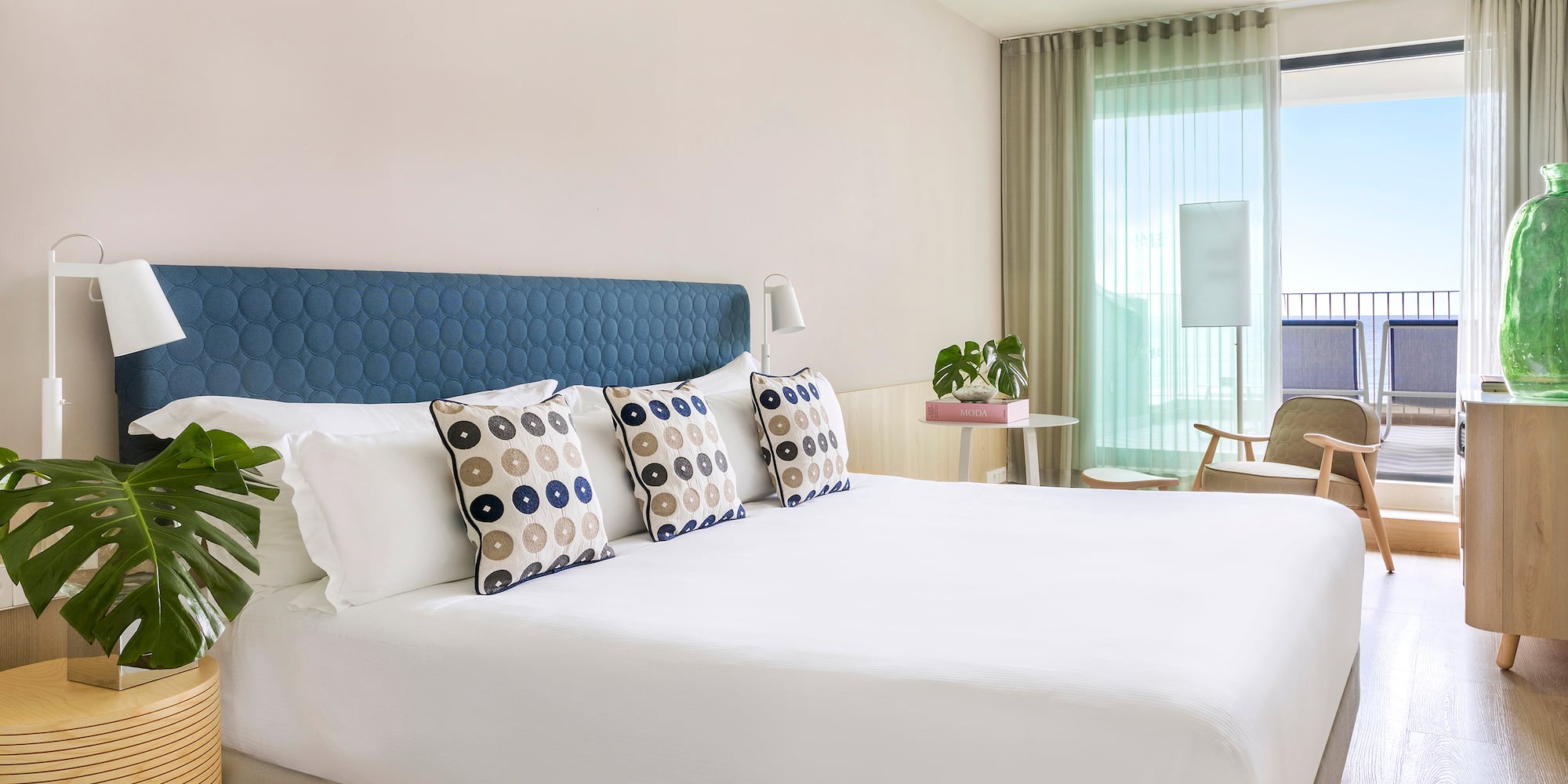 a bed with pillows in a room