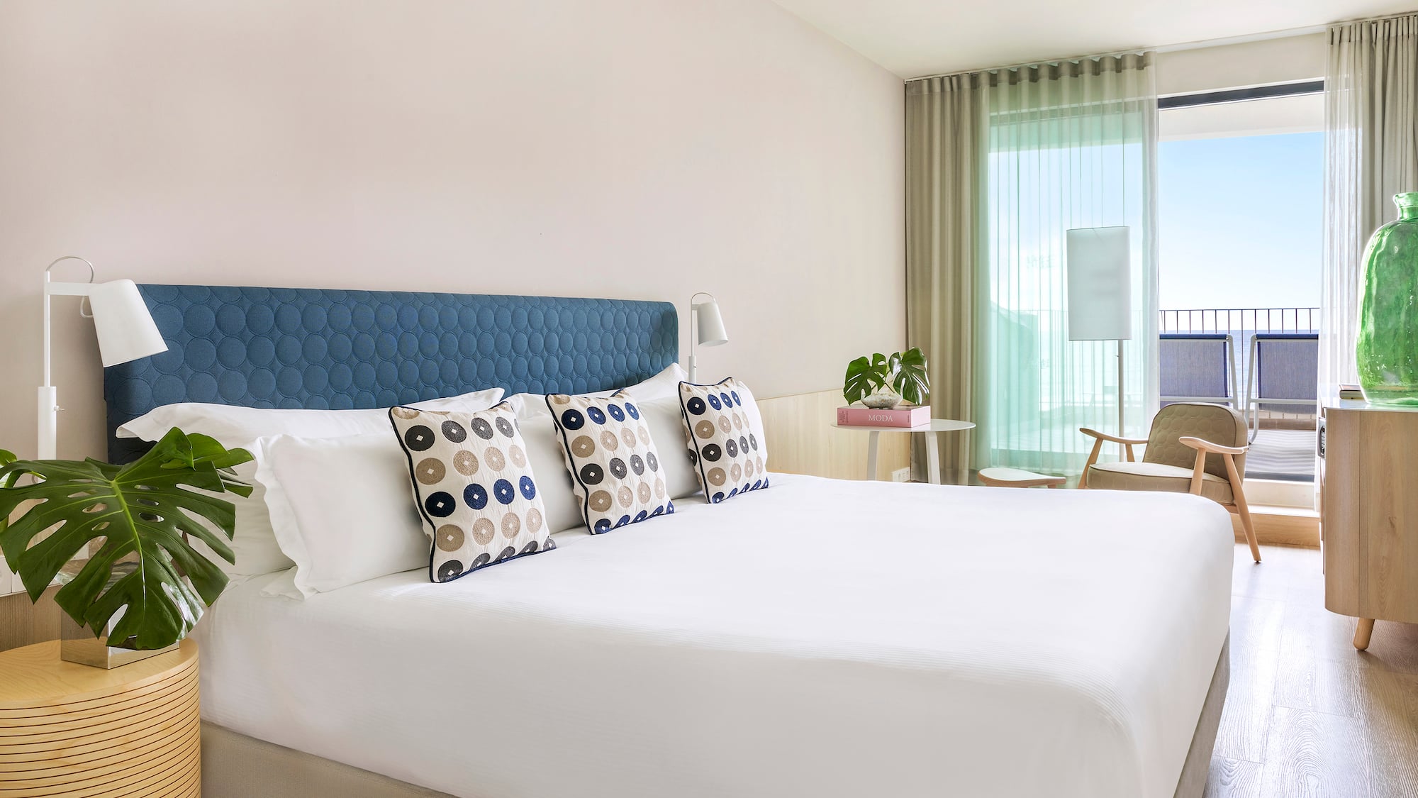 a bed with pillows in a room