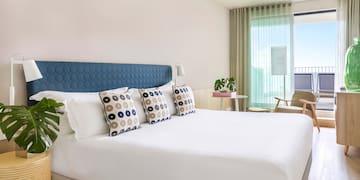 a bed with pillows in a room