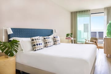 a bed with pillows in a room