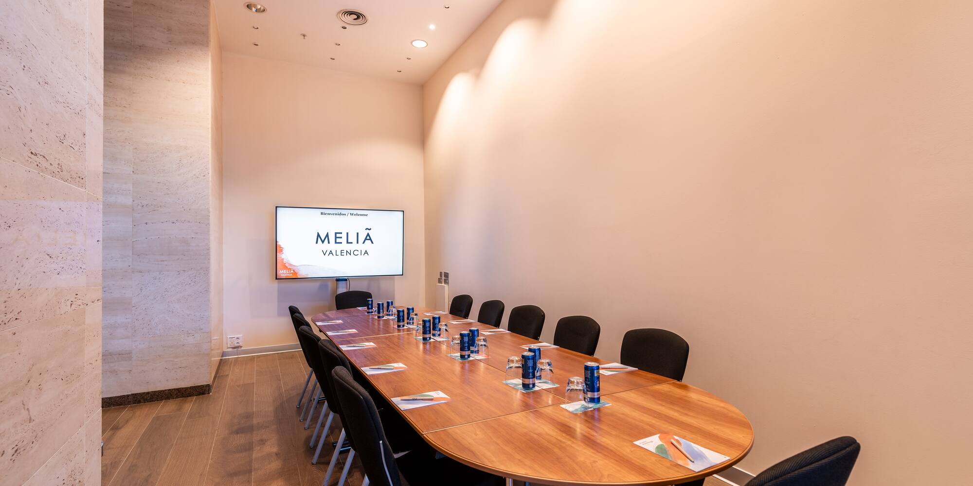 a conference room with a table and chairs