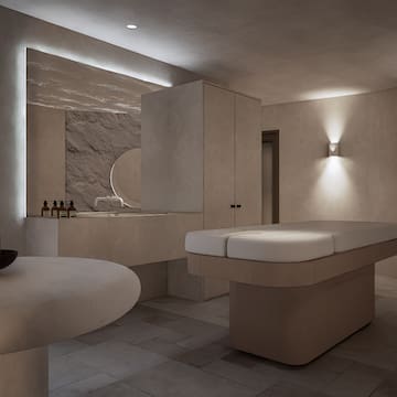 a room with a table and a mirror