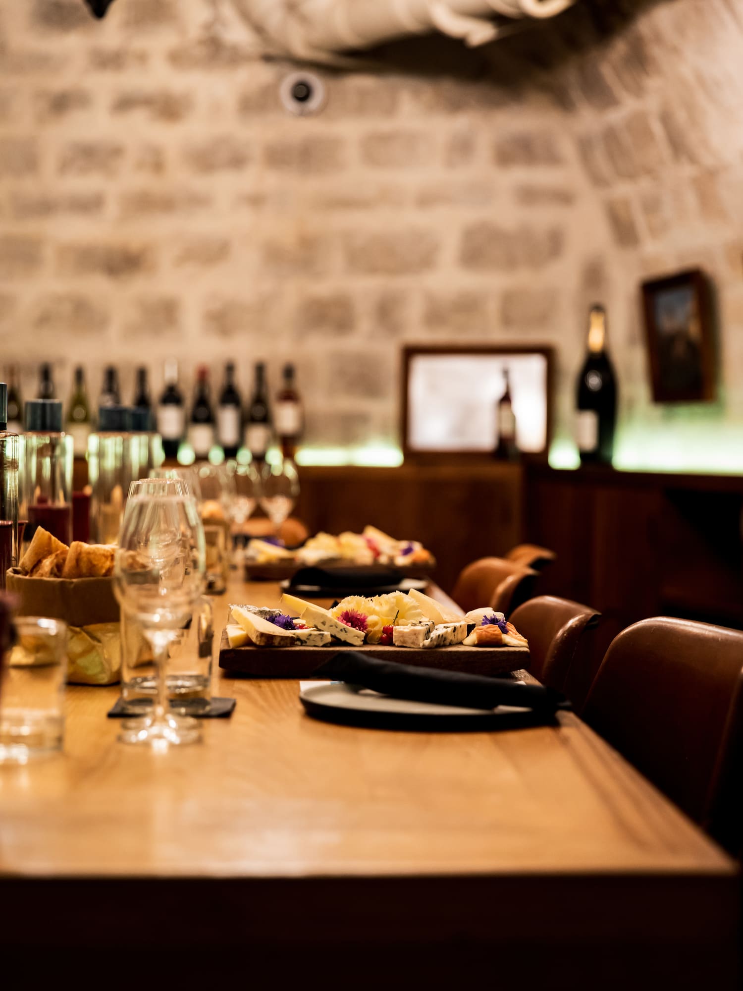 a table with food and wine glasses on it