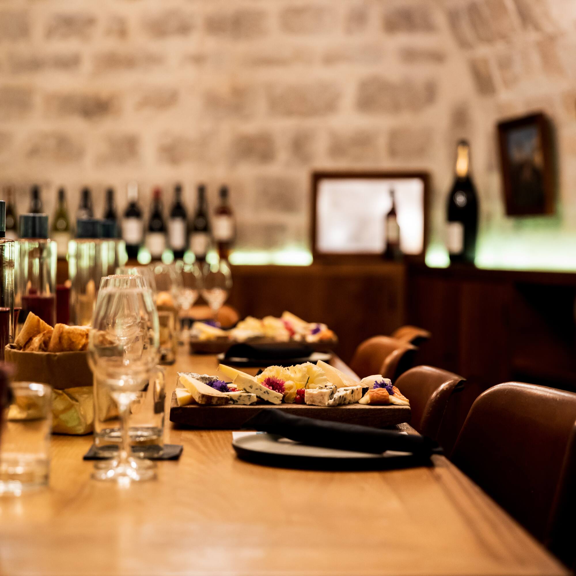 a table with food and wine glasses on it