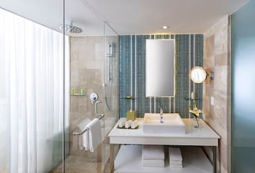 a bathroom with a shower and sink