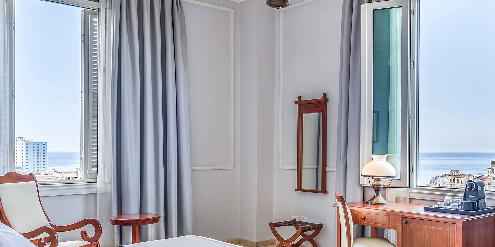 a bedroom with a bed and a desk and chair