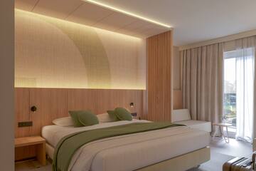 a bedroom with a bed and a table