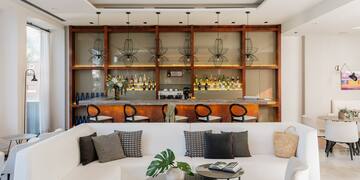 a room with a bar and a couch