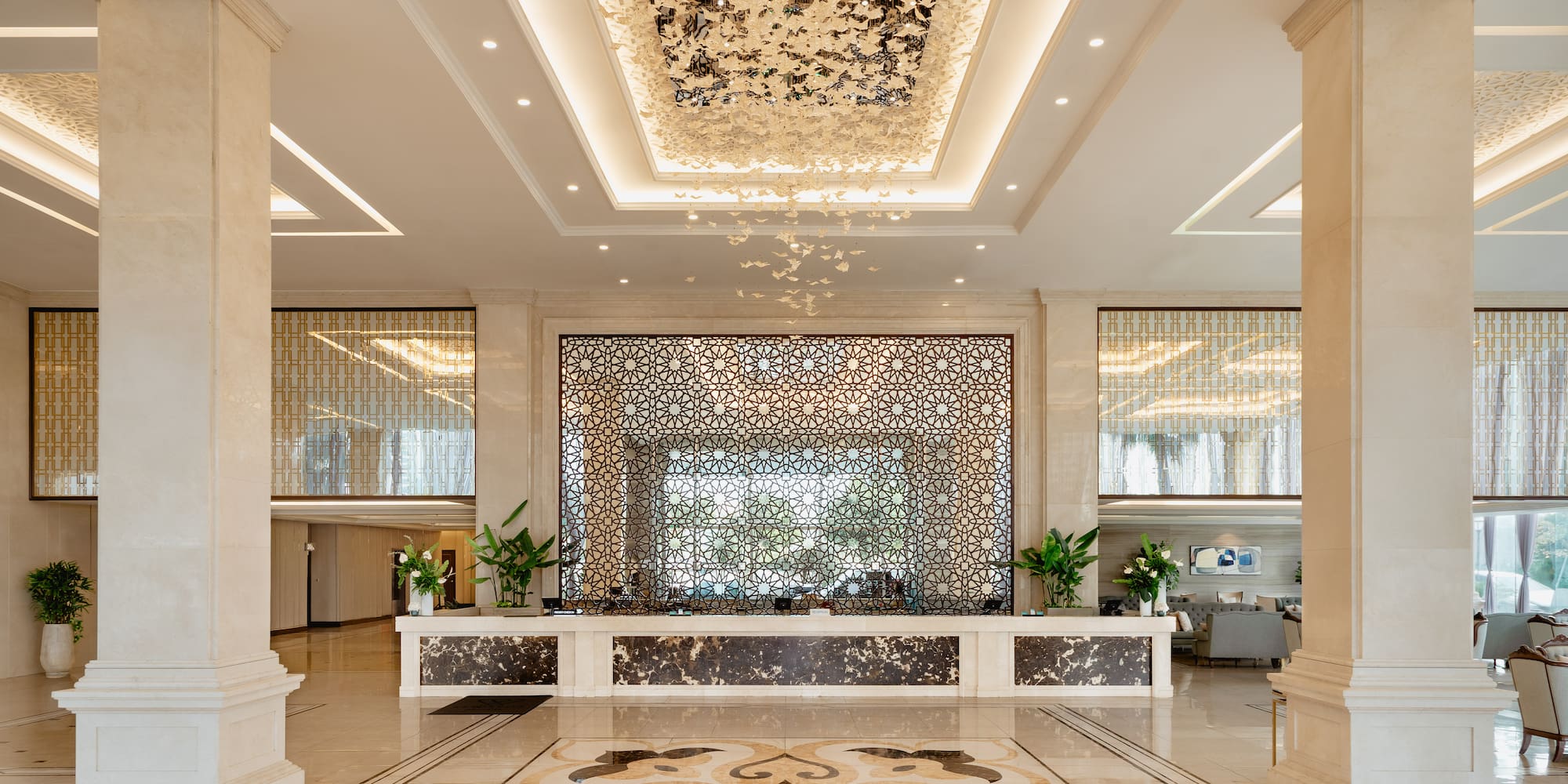 a lobby with columns and a large counter