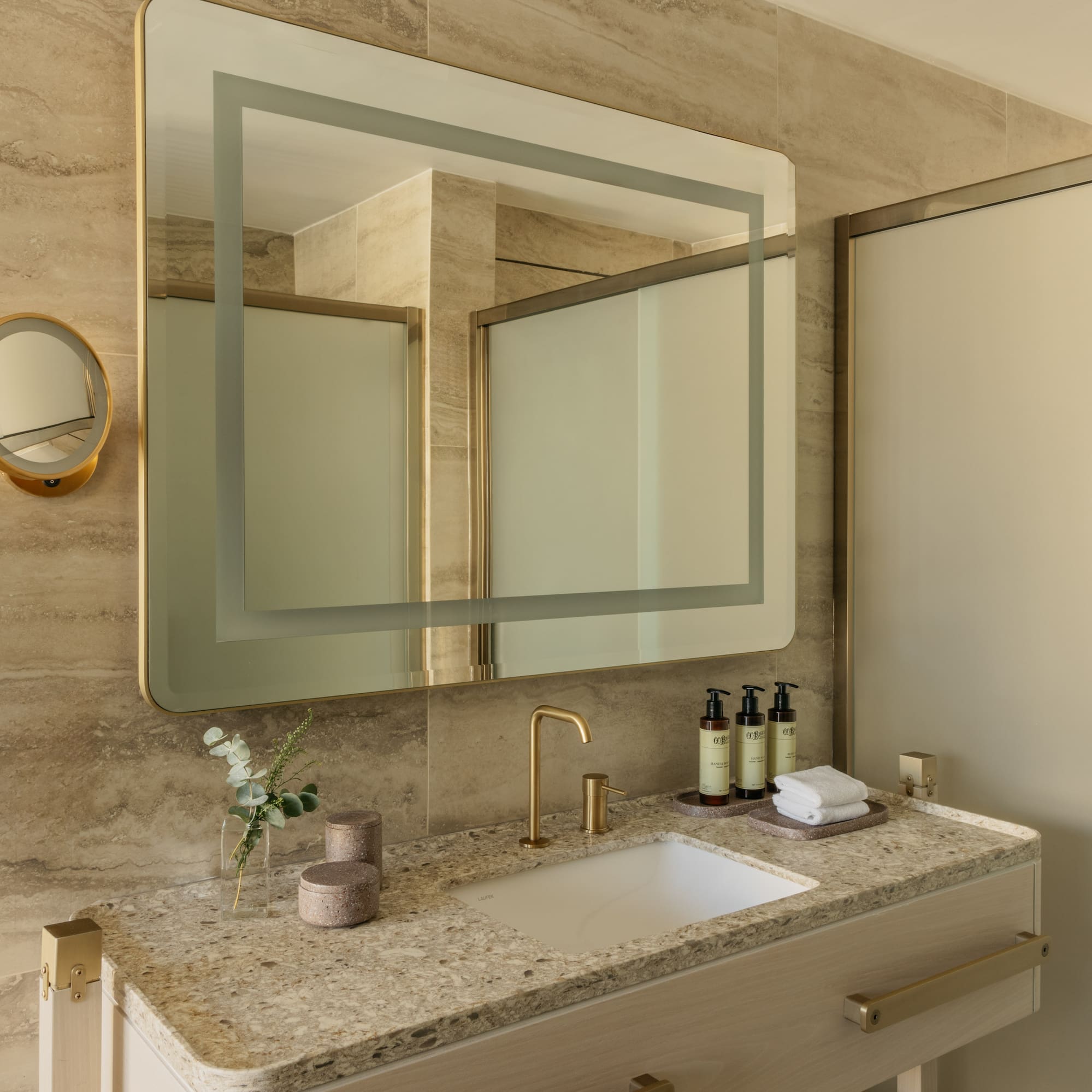 a bathroom with a mirror and sink