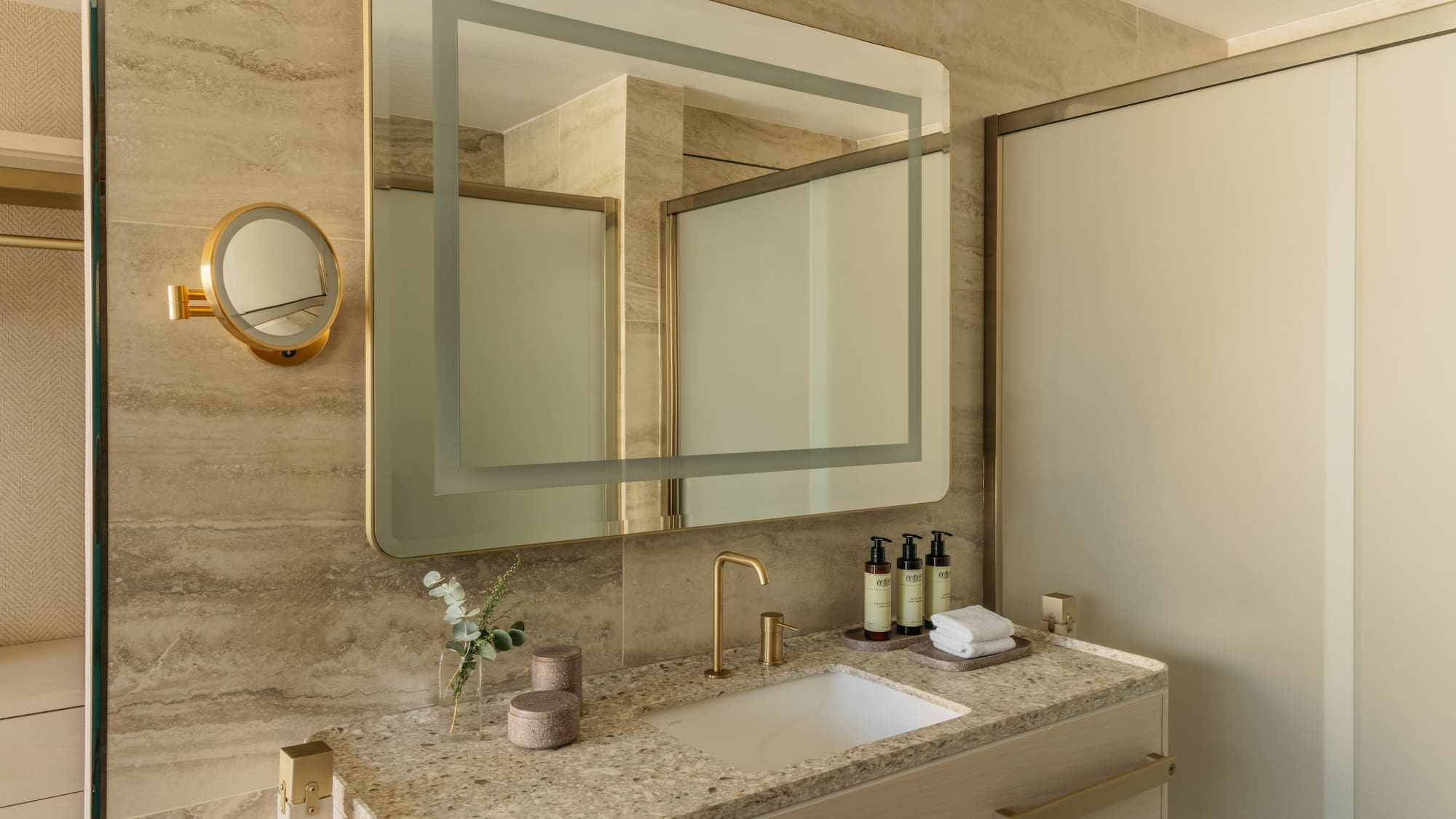 a bathroom with a mirror and sink