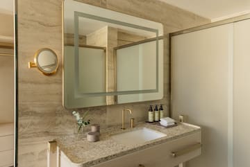 a bathroom with a mirror and sink