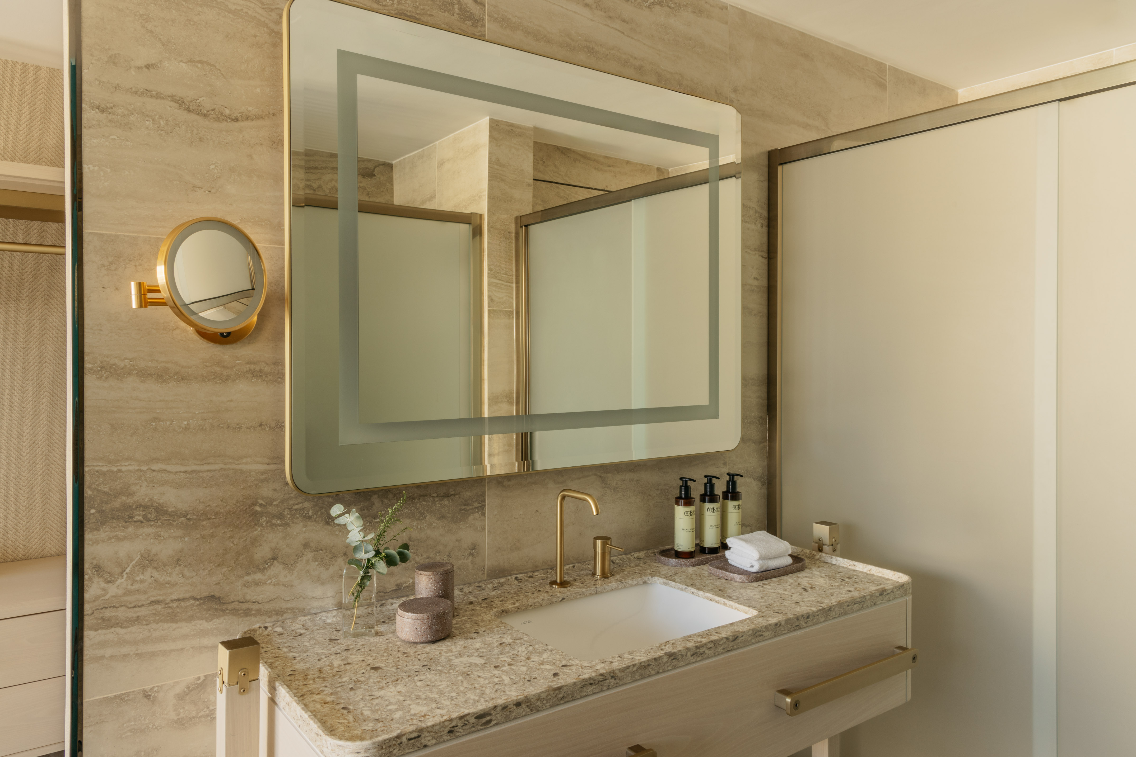 a bathroom with a mirror and sink