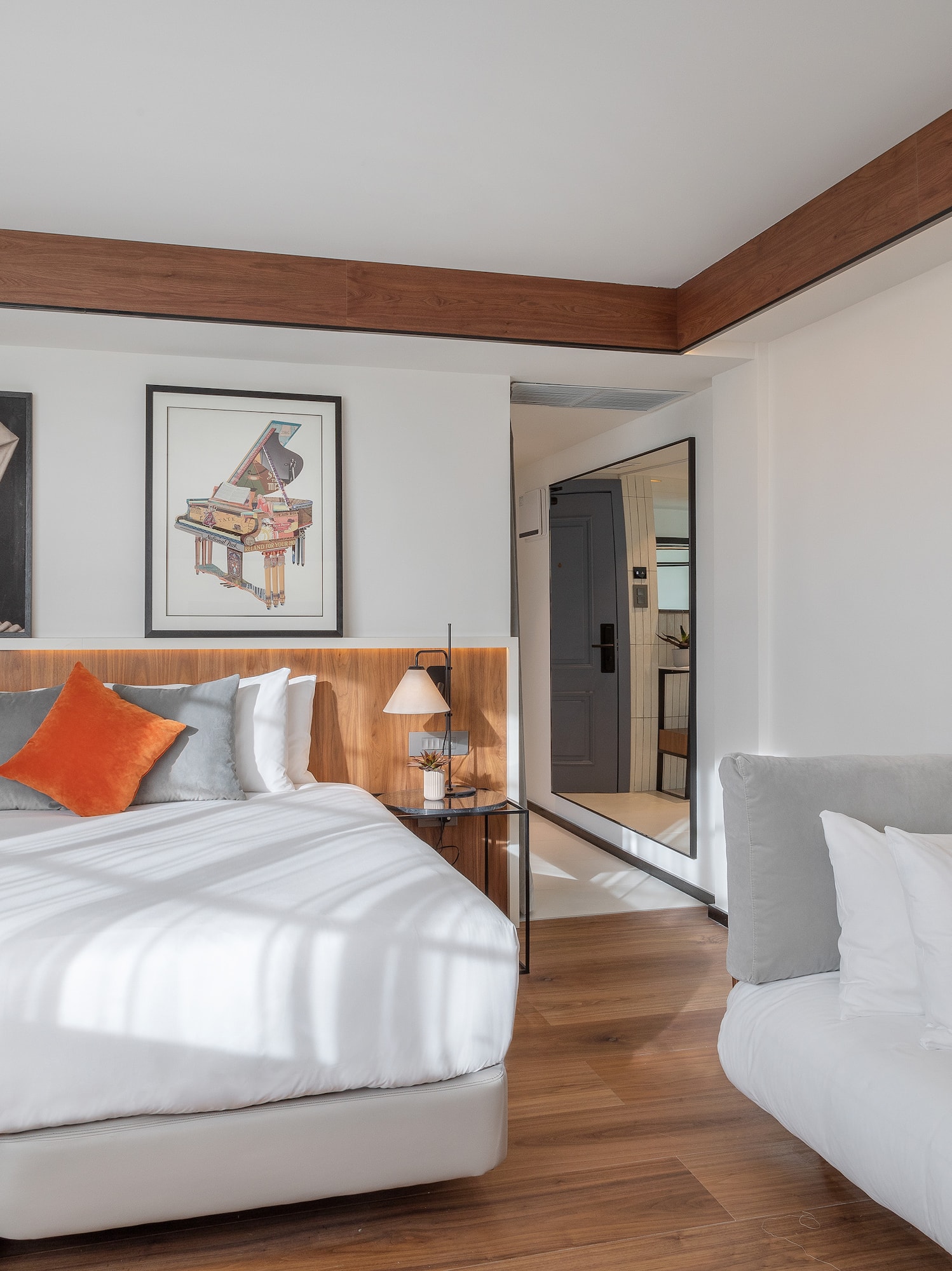 a bedroom with a bed and couches