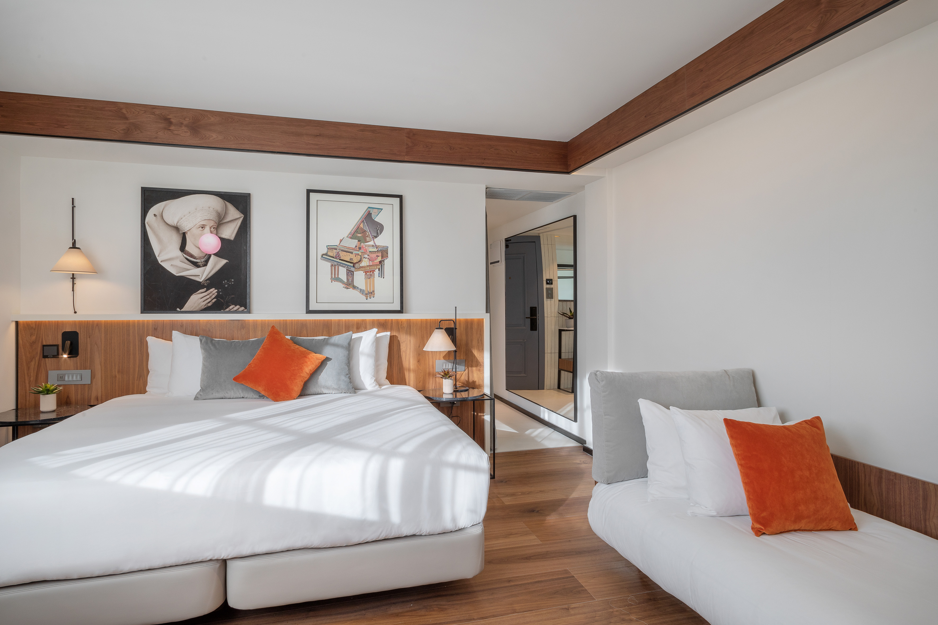 a bedroom with a bed and couches