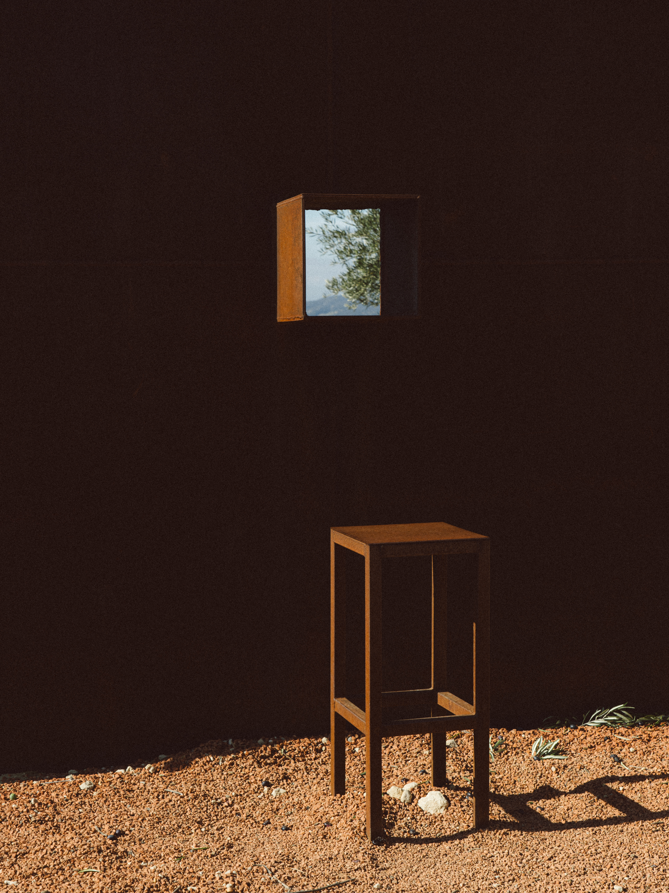 a small square window in a dark room