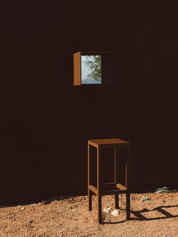 a small square window in a dark room