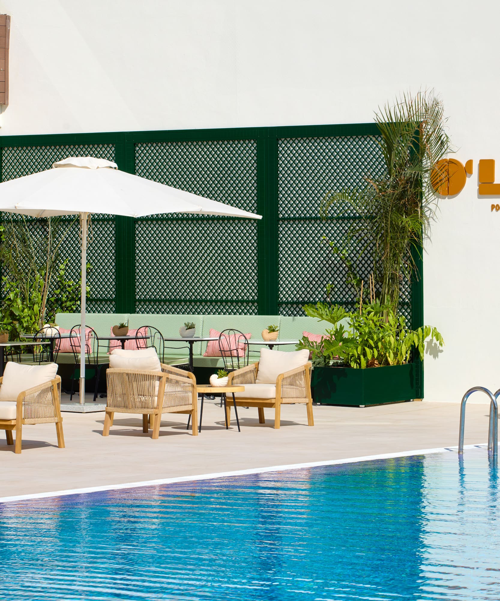 a pool with chairs and umbrellas