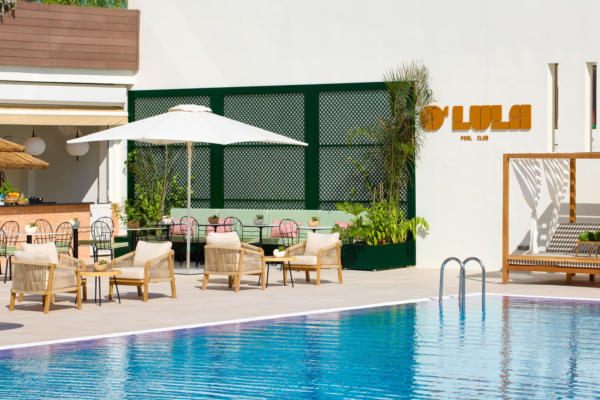 a pool with chairs and umbrellas