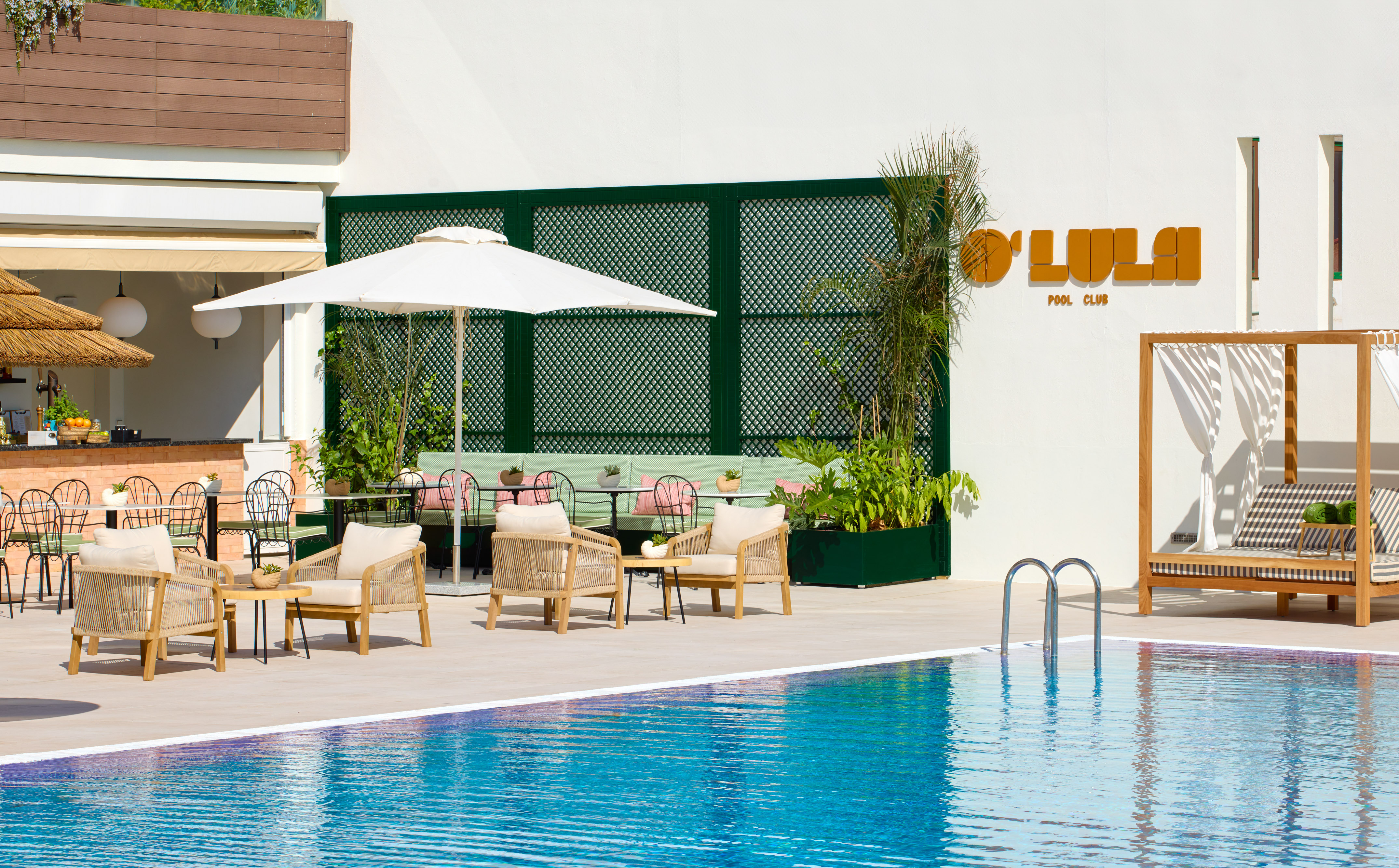a pool with chairs and umbrellas