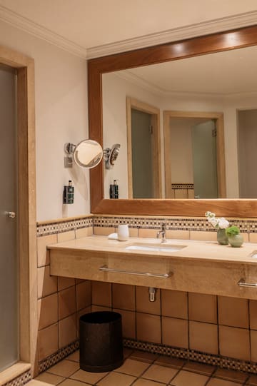 a bathroom with a mirror and sink