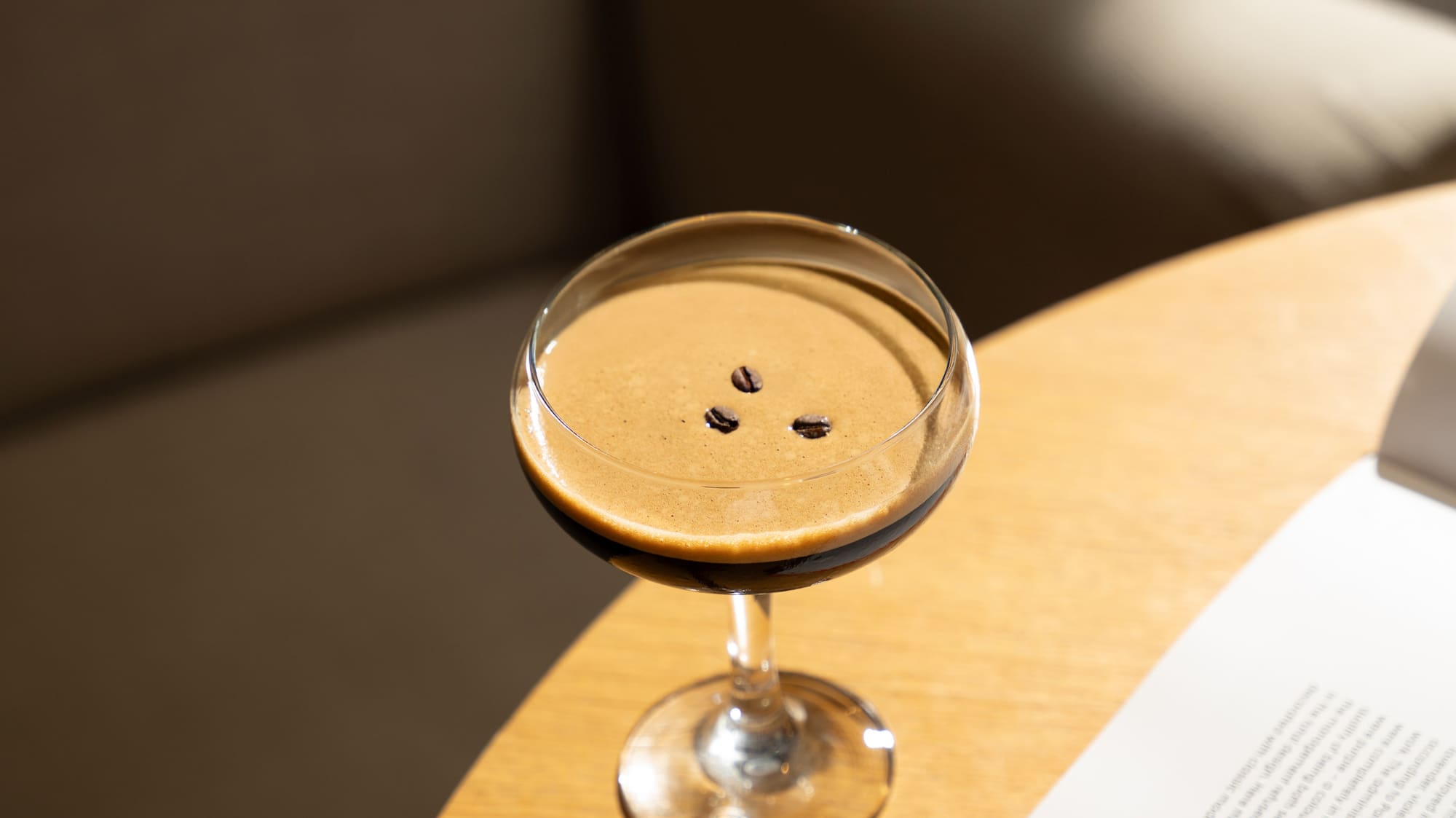 a drink in a glass on a table