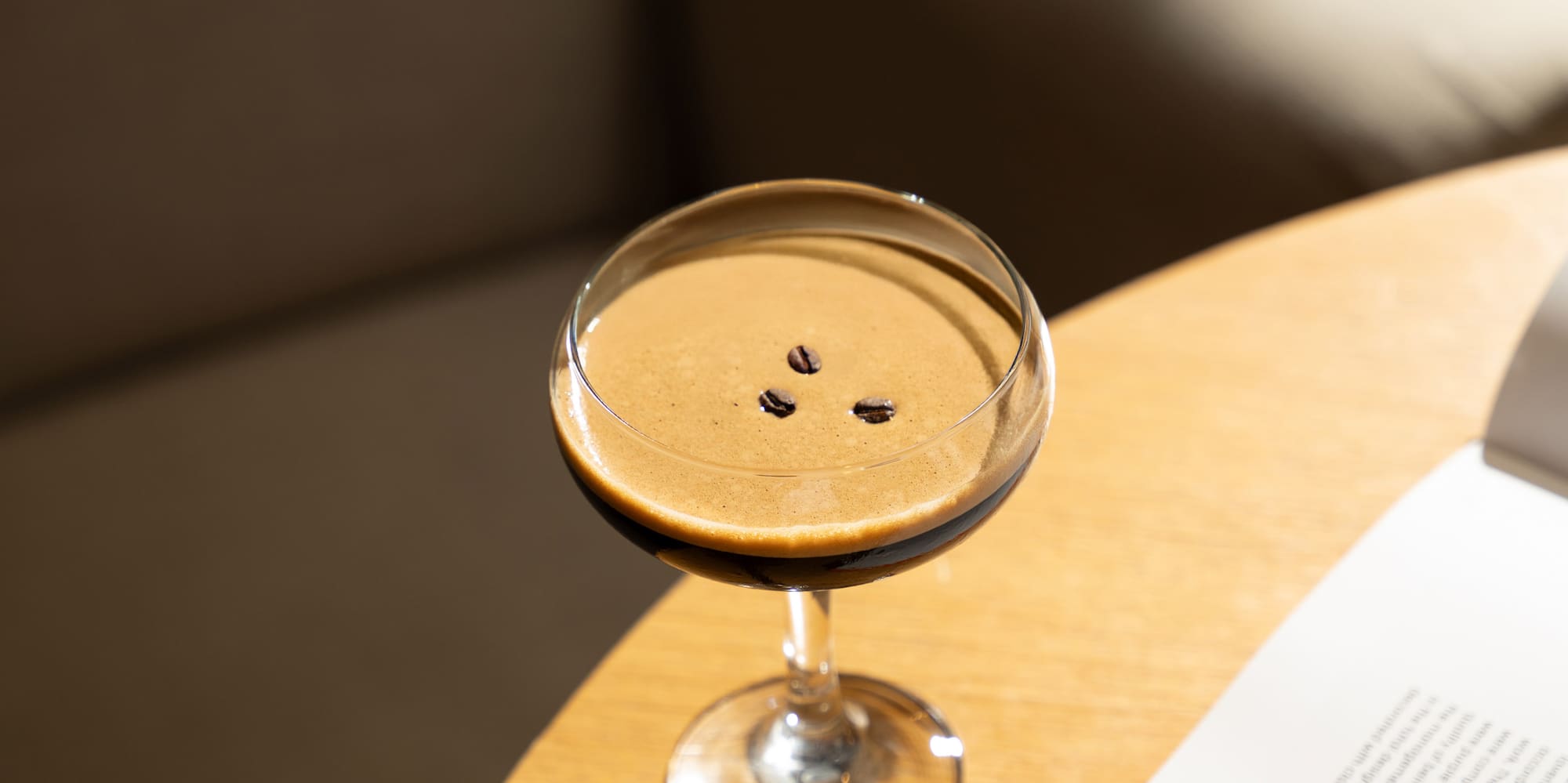 a drink in a glass on a table