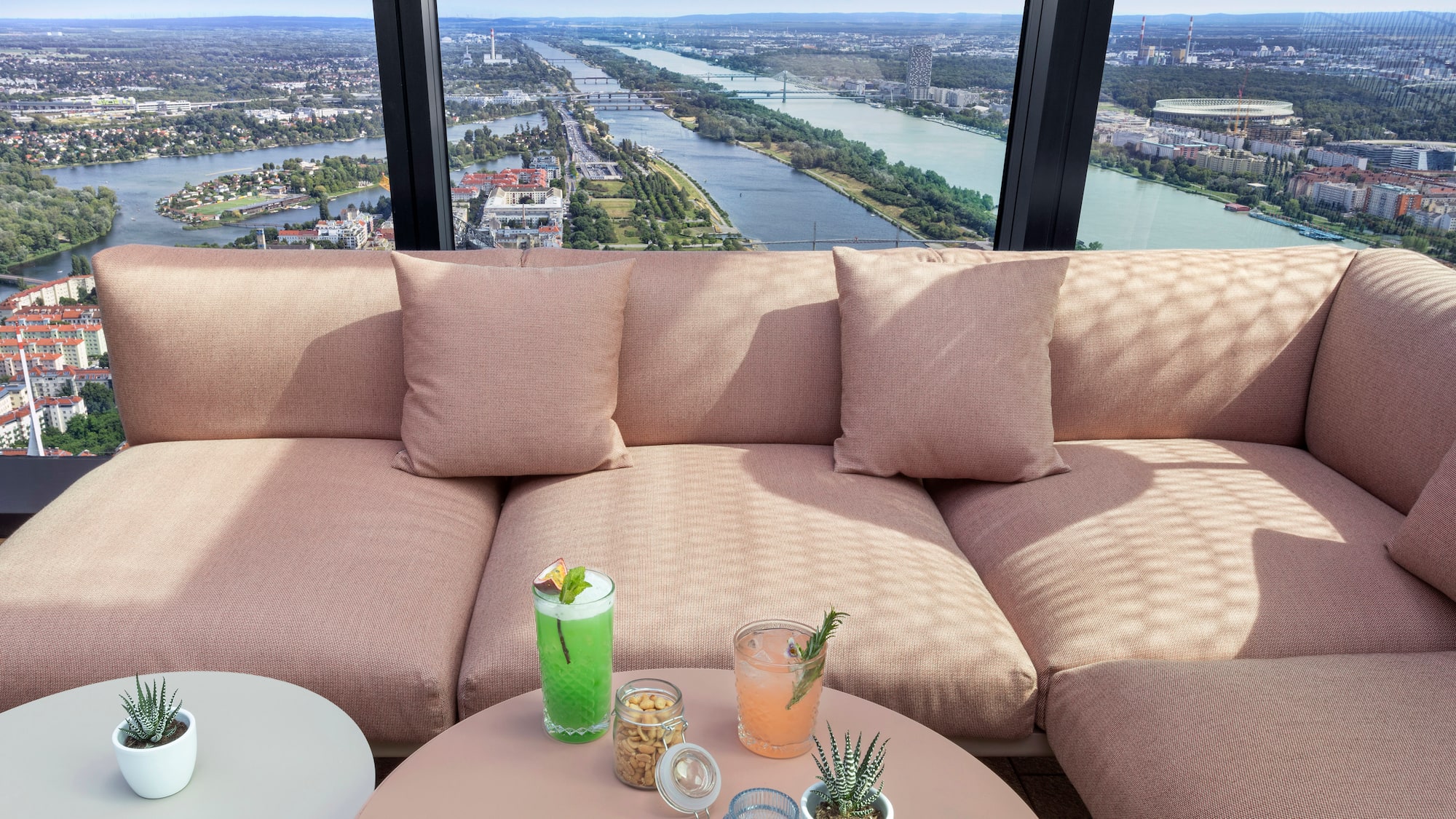 a couch with drinks on a table
