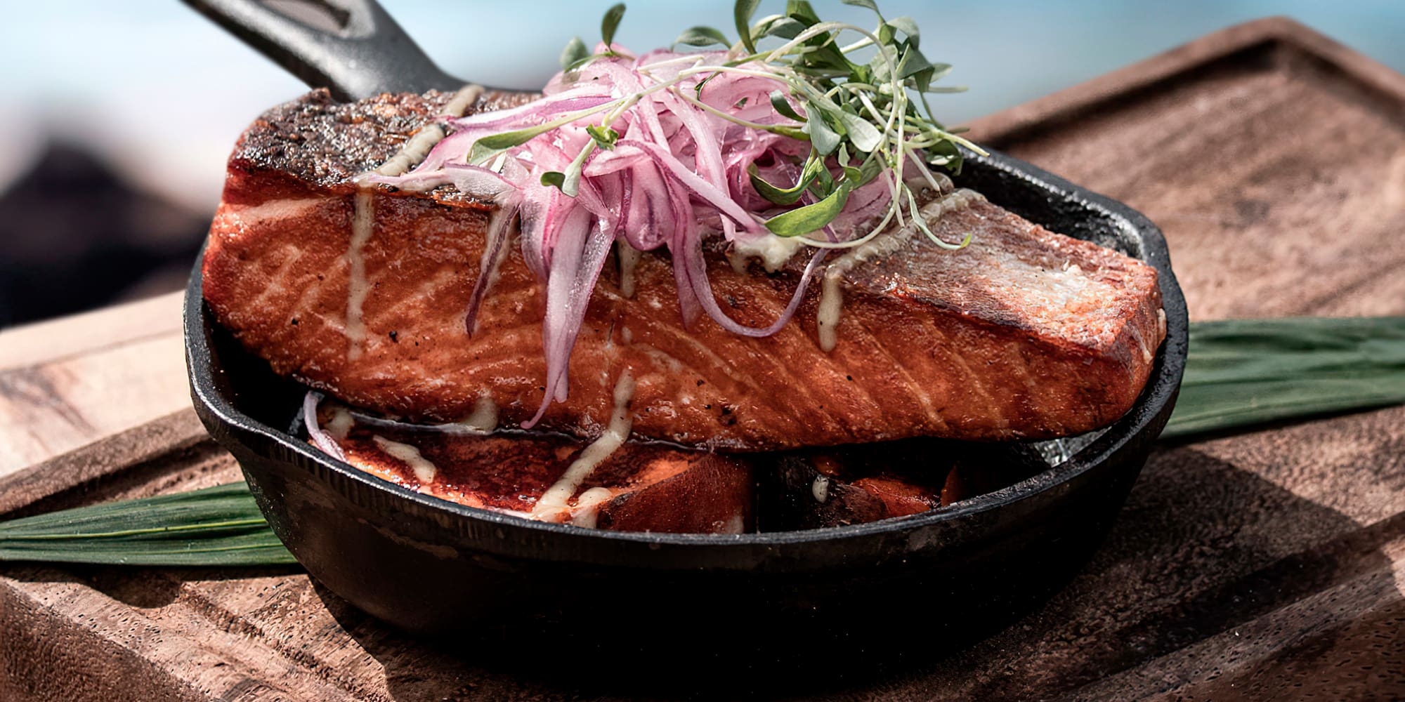 a pan of food on a cutting board