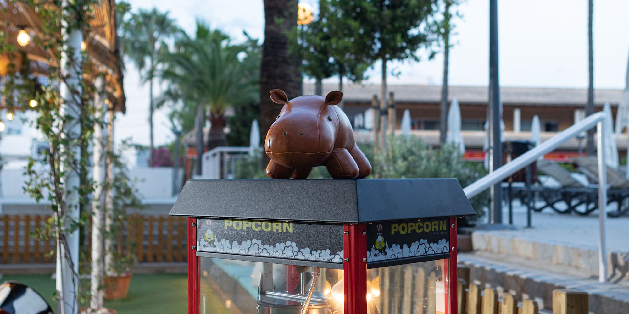 a popcorn machine with a toy on top