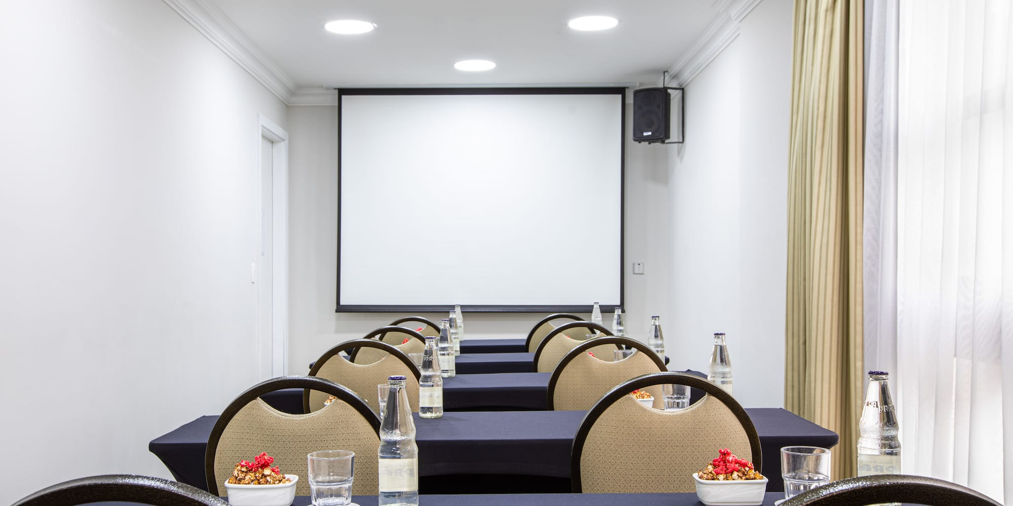 a room with tables and chairs