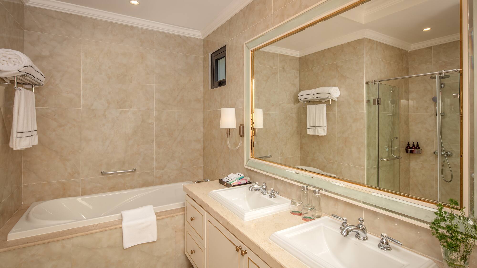 a bathroom with a large mirror and sink