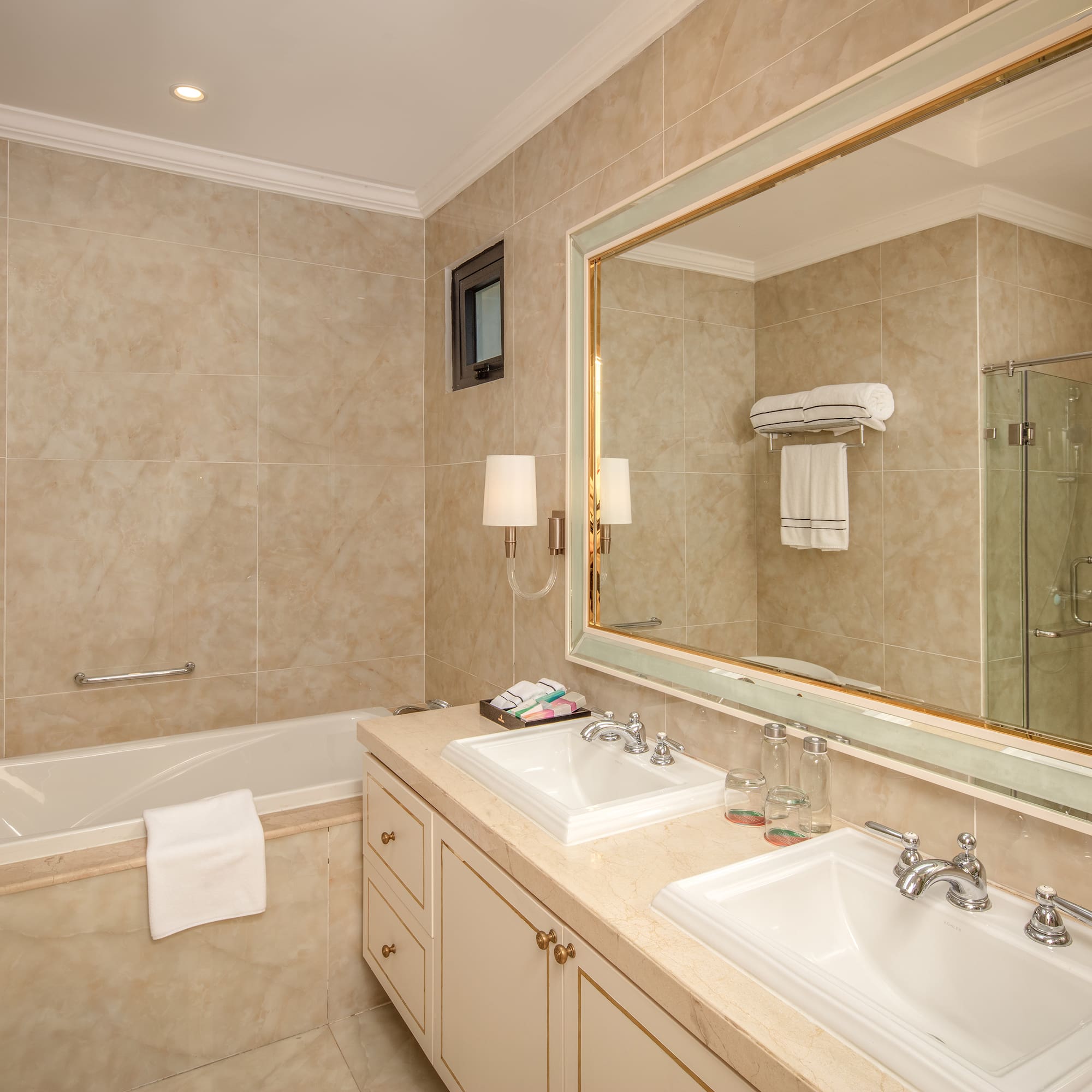 a bathroom with a large mirror and sink