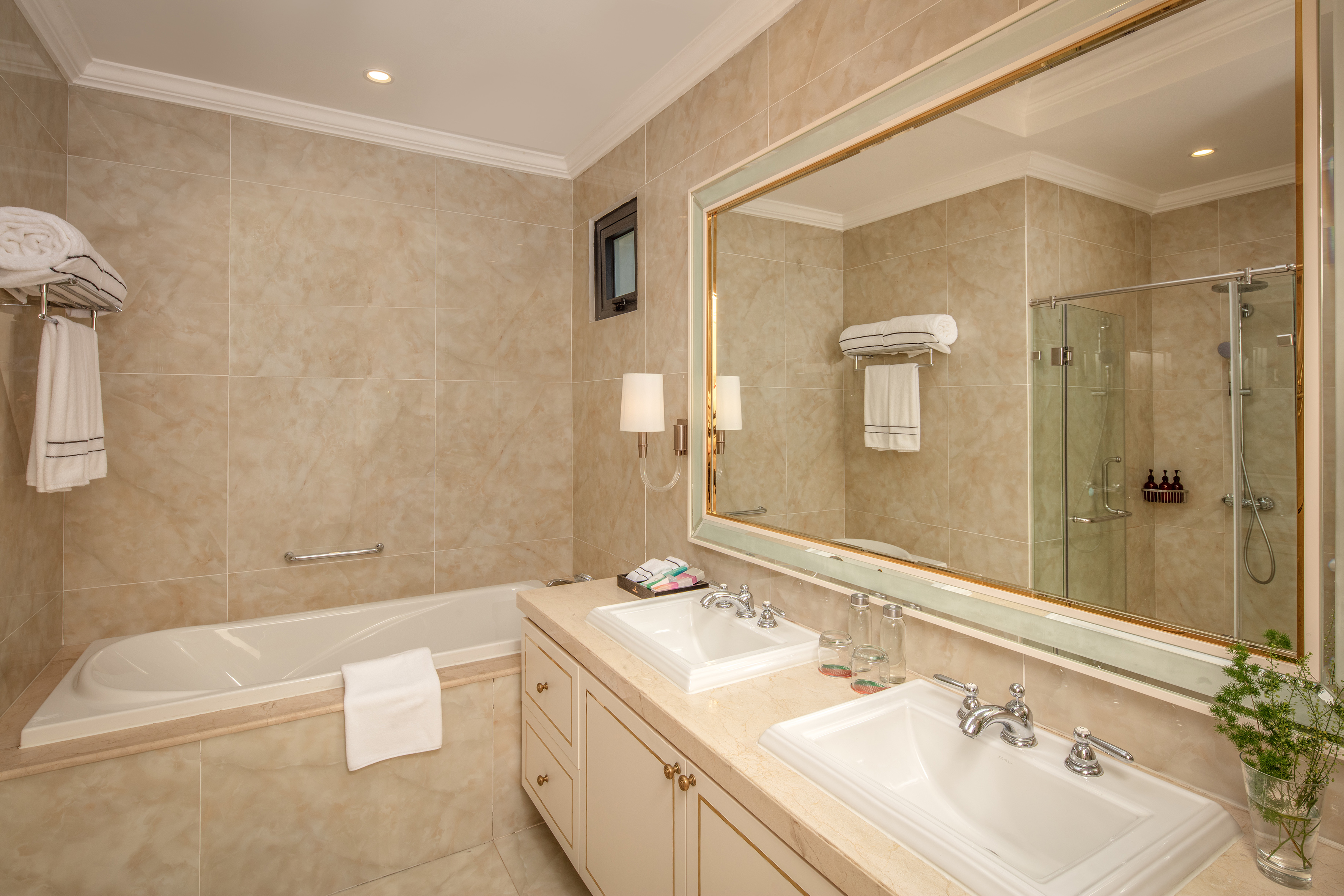 a bathroom with a large mirror and sink