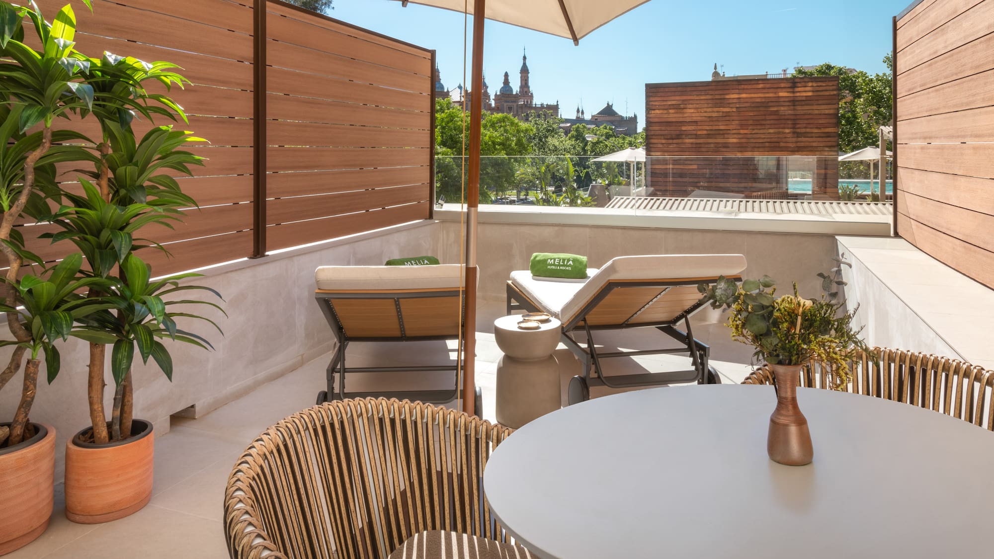 a patio with a table and chairs and a umbrella