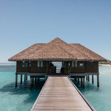 a building on stilts in the water