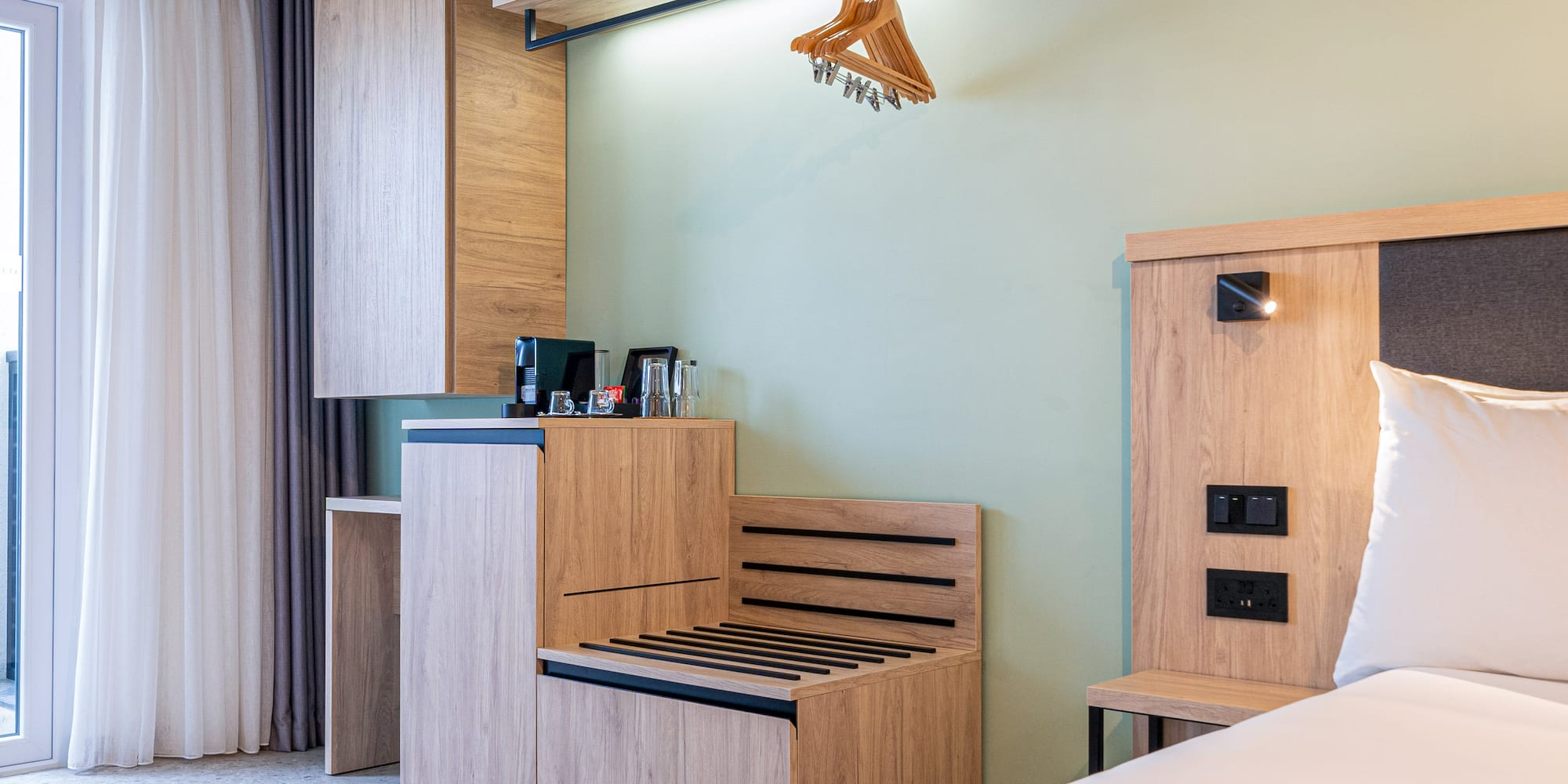 a room with a bench and a bed