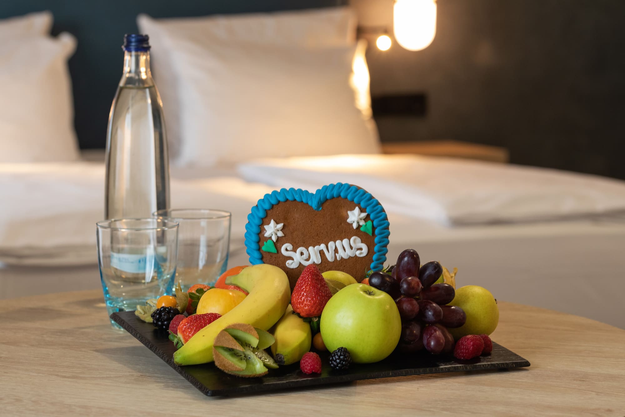 a plate of fruit and a bottle of water