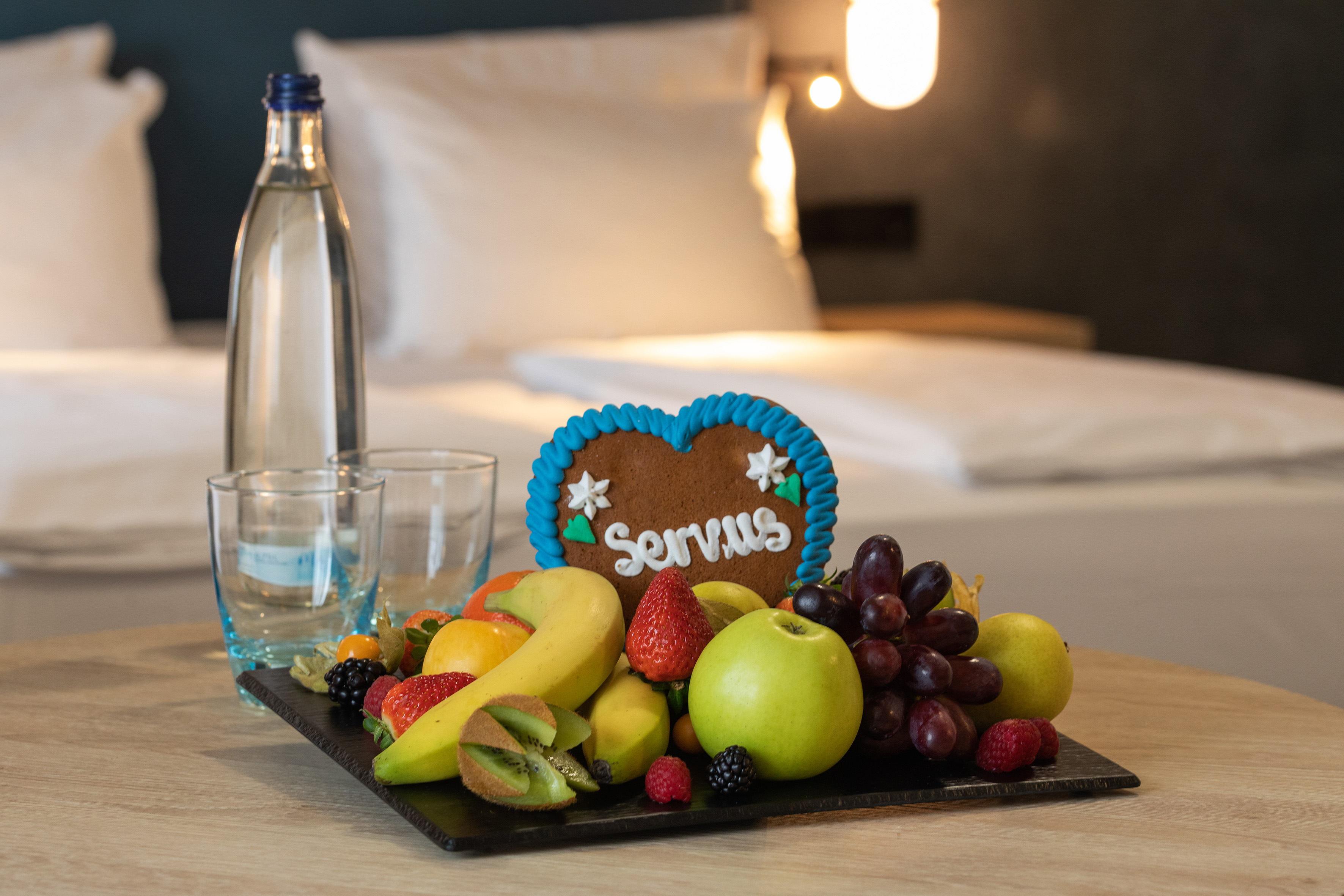 a plate of fruit and a bottle of water