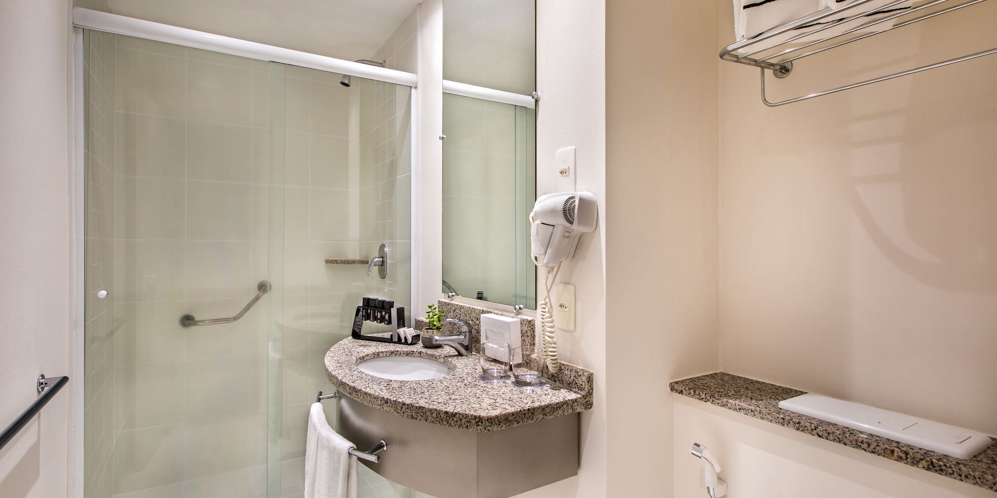 a bathroom with a sink and shower