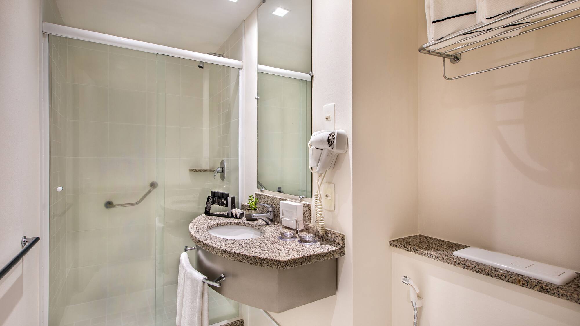 a bathroom with a sink and shower