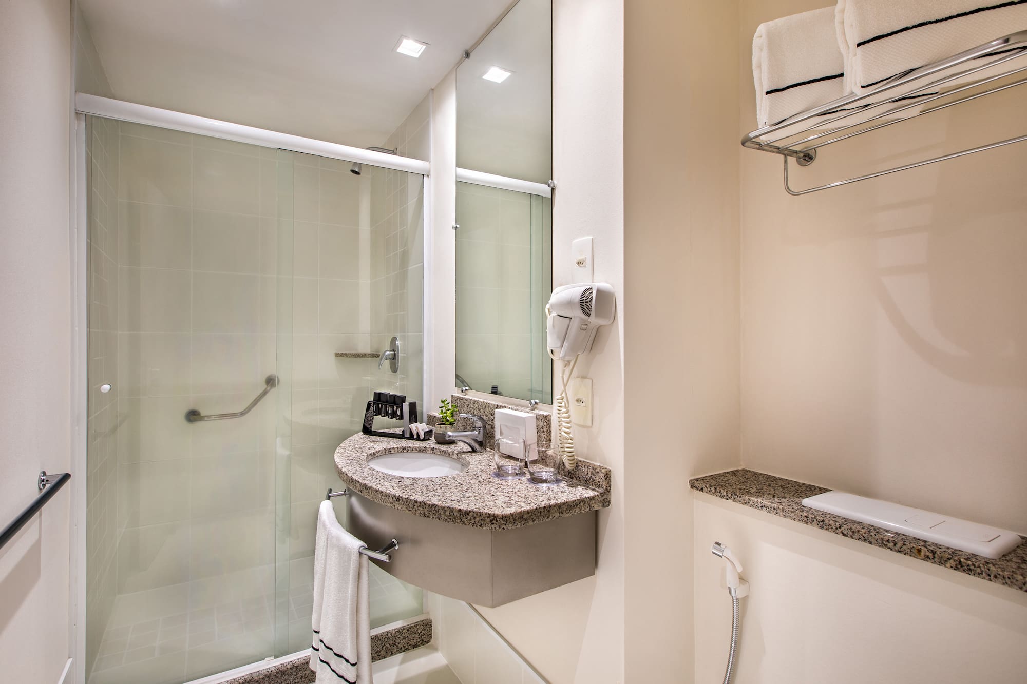 a bathroom with a sink and shower
