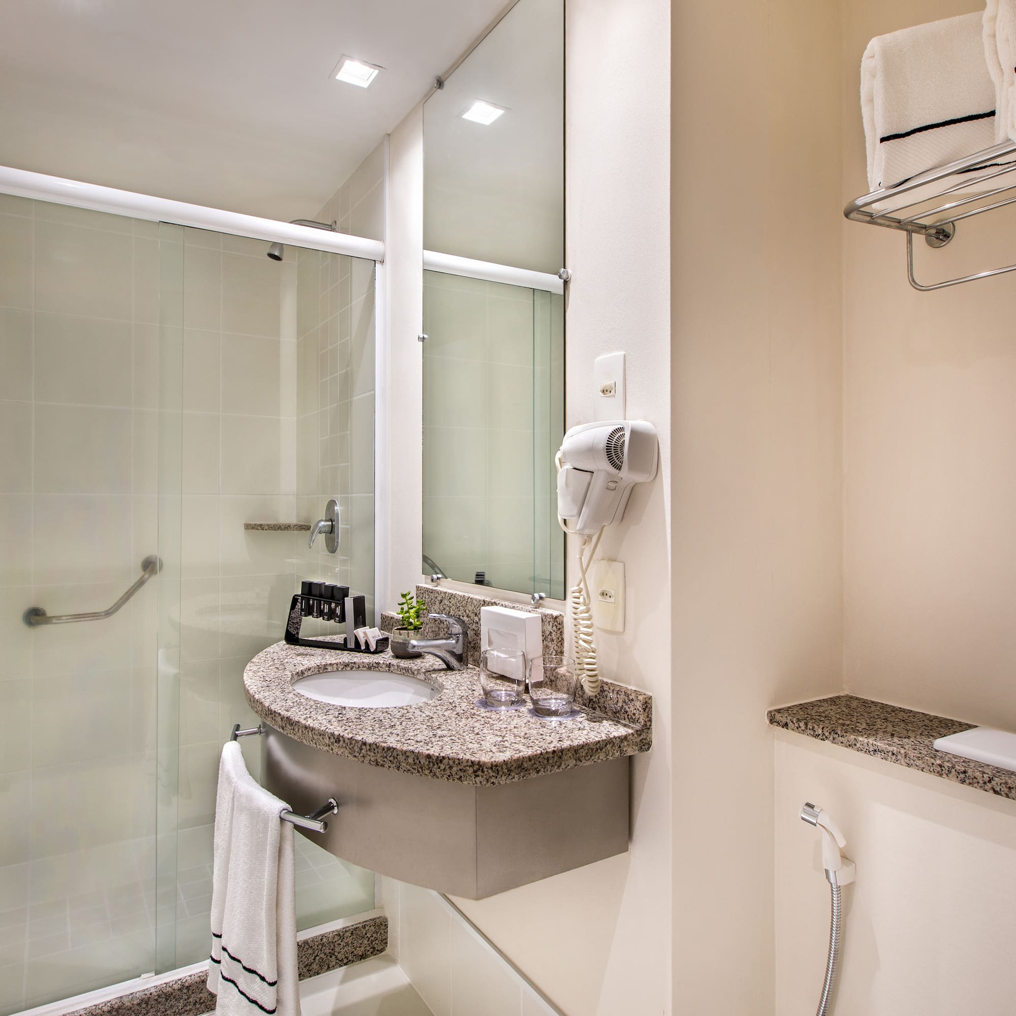 a bathroom with a sink and shower