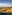 Valletta, Malta cityscape and historic fortifications at sunset over the harbor.