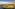 Valletta, Malta cityscape and historic fortifications at sunset over the harbor.