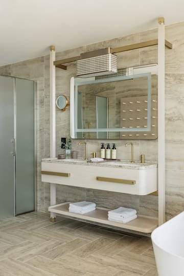 a bathroom with a mirror and sink