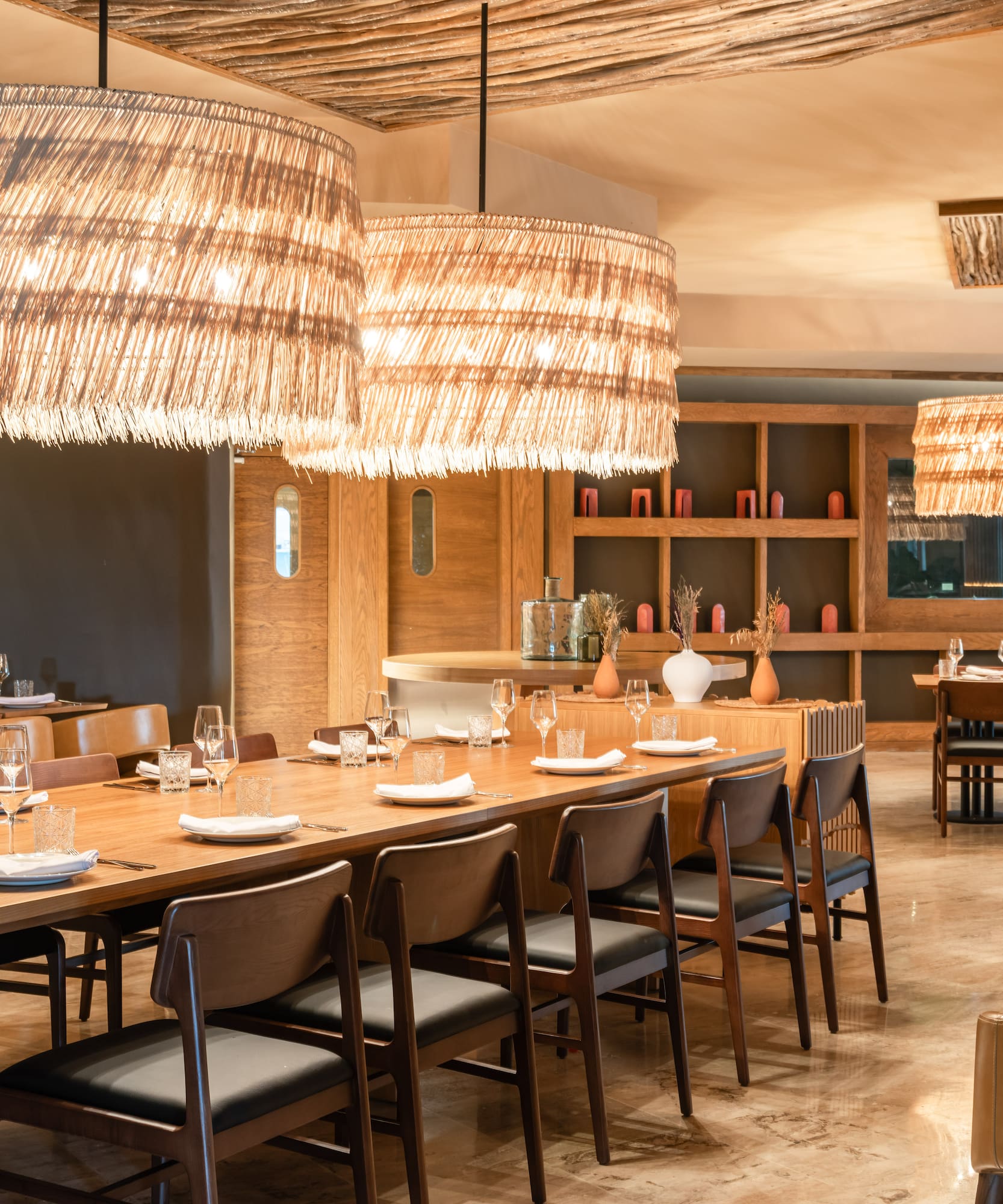 a large dining room with a large table and chairs