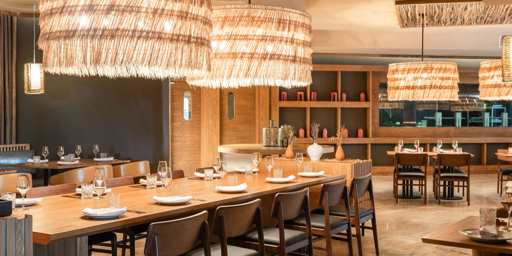 a large dining room with a large table and chairs